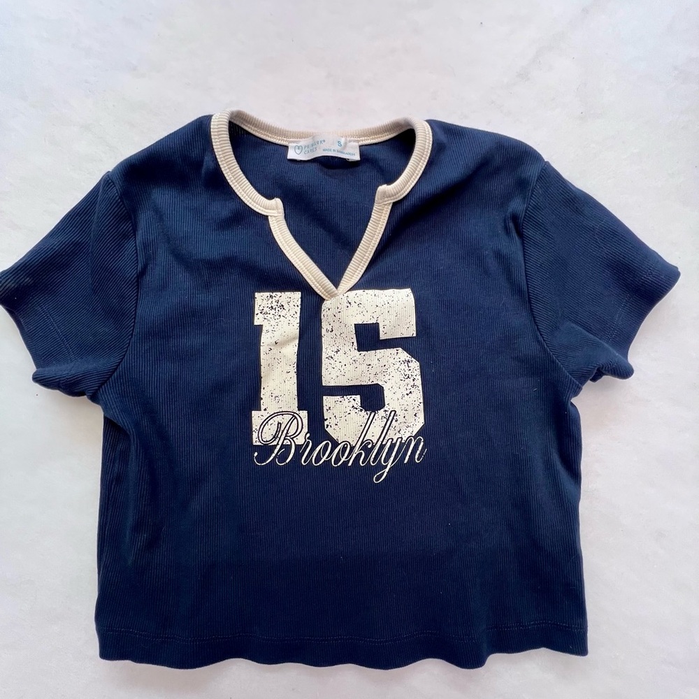 Primark‎ Blue Cropped Shirt with “15 Brooklyn“ on front,
Small